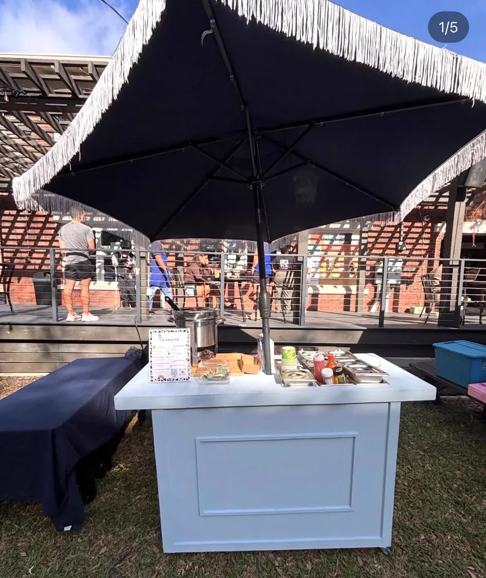 The cart under a pavilion with the umbrella